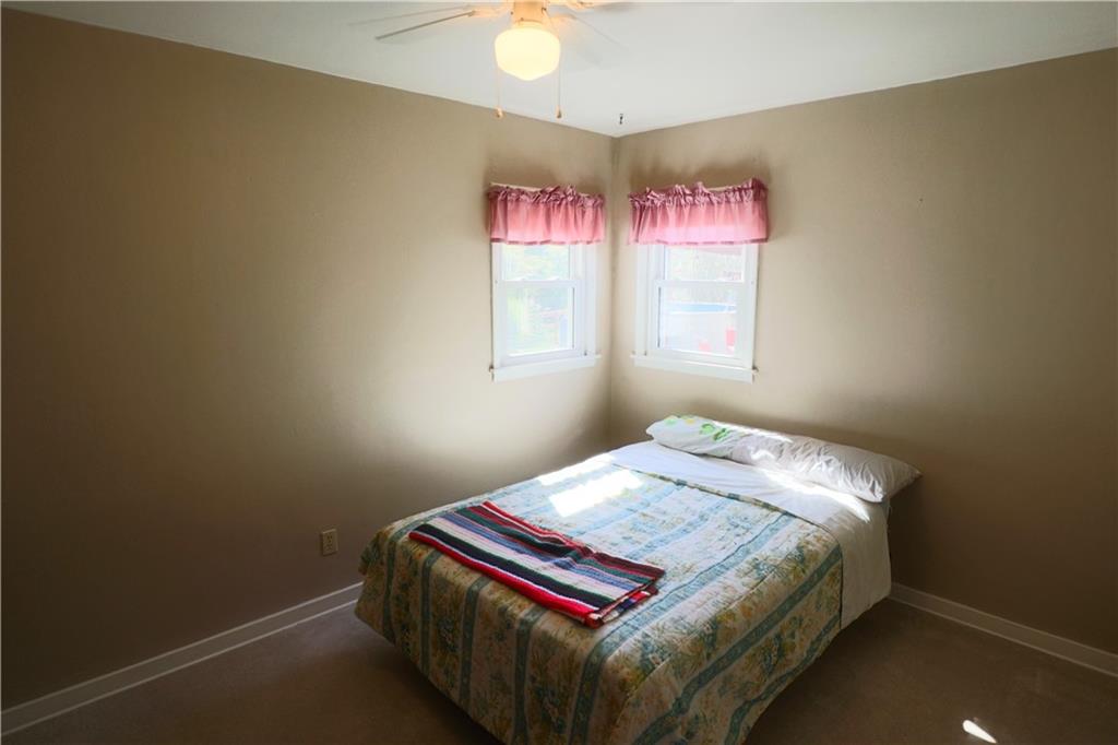 1340 Barkley Road McKeesport, PA 15133 - Photo 14 of 20 a bedroom with a bed and a window