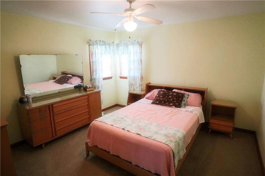 1340 Barkley Road McKeesport, PA 15133 - Photo 15 of 20 a bedroom with a bed and a chandelier