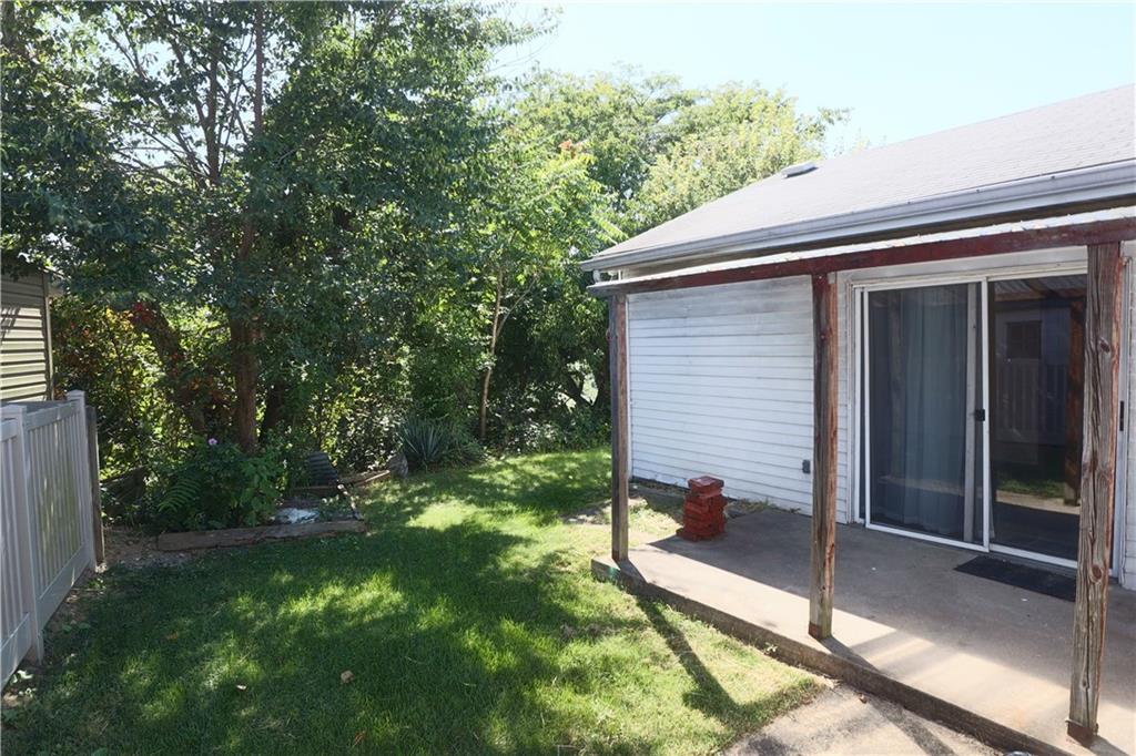 1340 Barkley Road McKeesport, PA 15133 - Photo 20 of 20 a view of a chair and table in the back yard