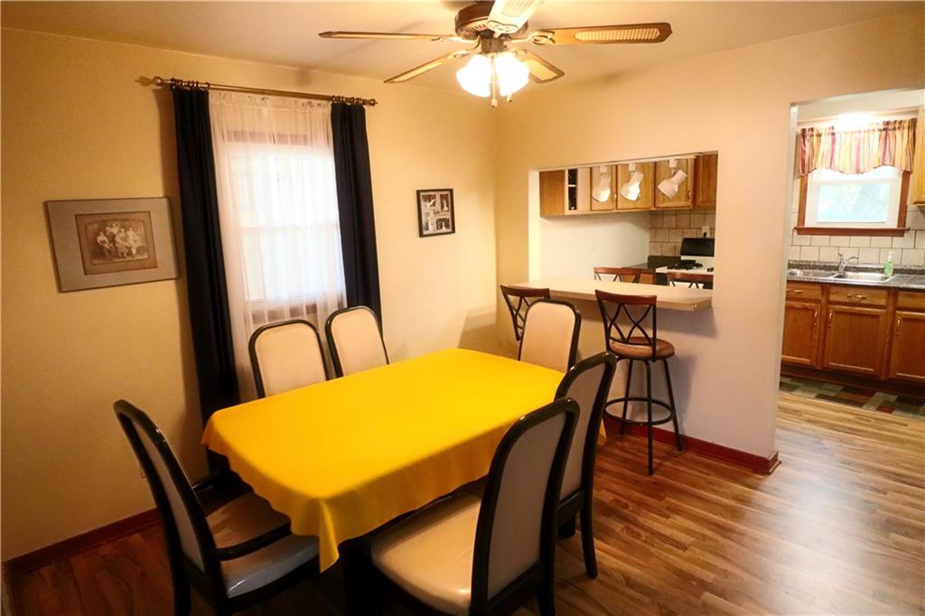 1340 Barkley Road McKeesport, PA 15133 - Photo 5 of 20 a view of a dining room with furniture and wooden floor