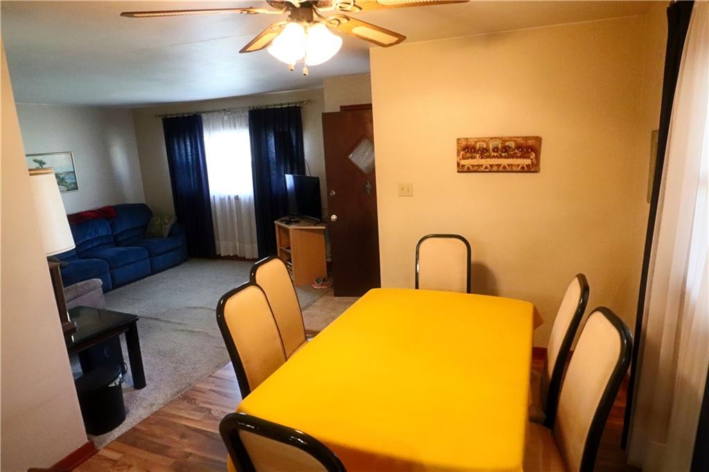 1340 Barkley Road McKeesport, PA 15133 - Photo 6 of 20 a view of a dining room with furniture and wooden floor