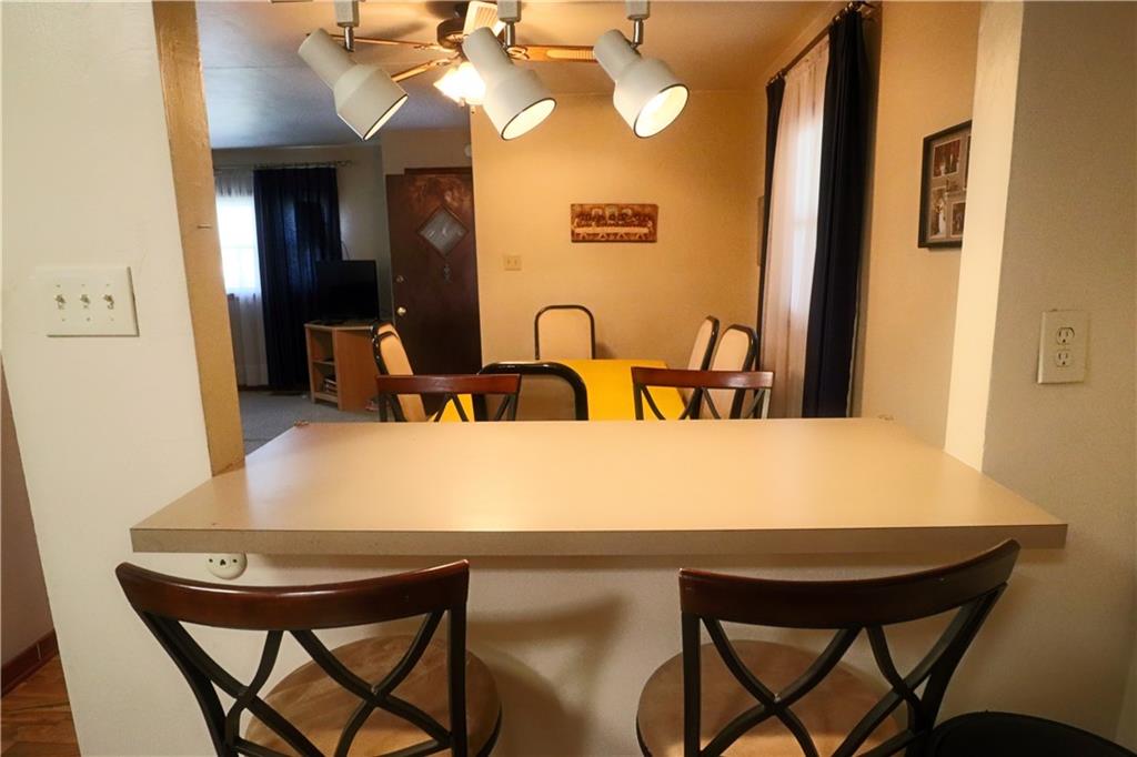 1340 Barkley Road McKeesport, PA 15133 - Photo 7 of 20 a view of a dining room with furniture and chandelier
