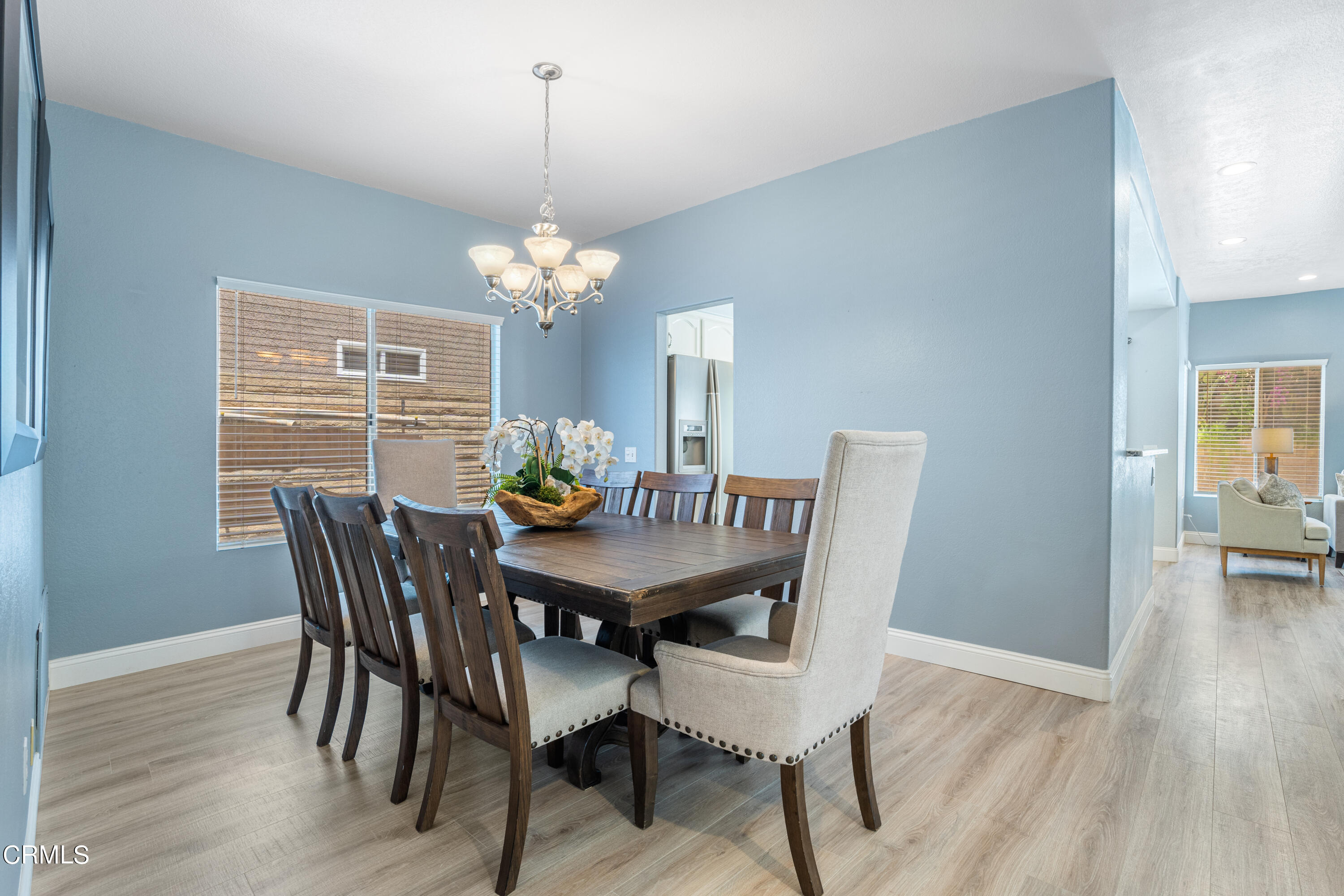 15737 Milne Circle Moorpark, CA 93021 - Photo 13 of 38 a view of a dining room with furniture wooden floor and chandelier