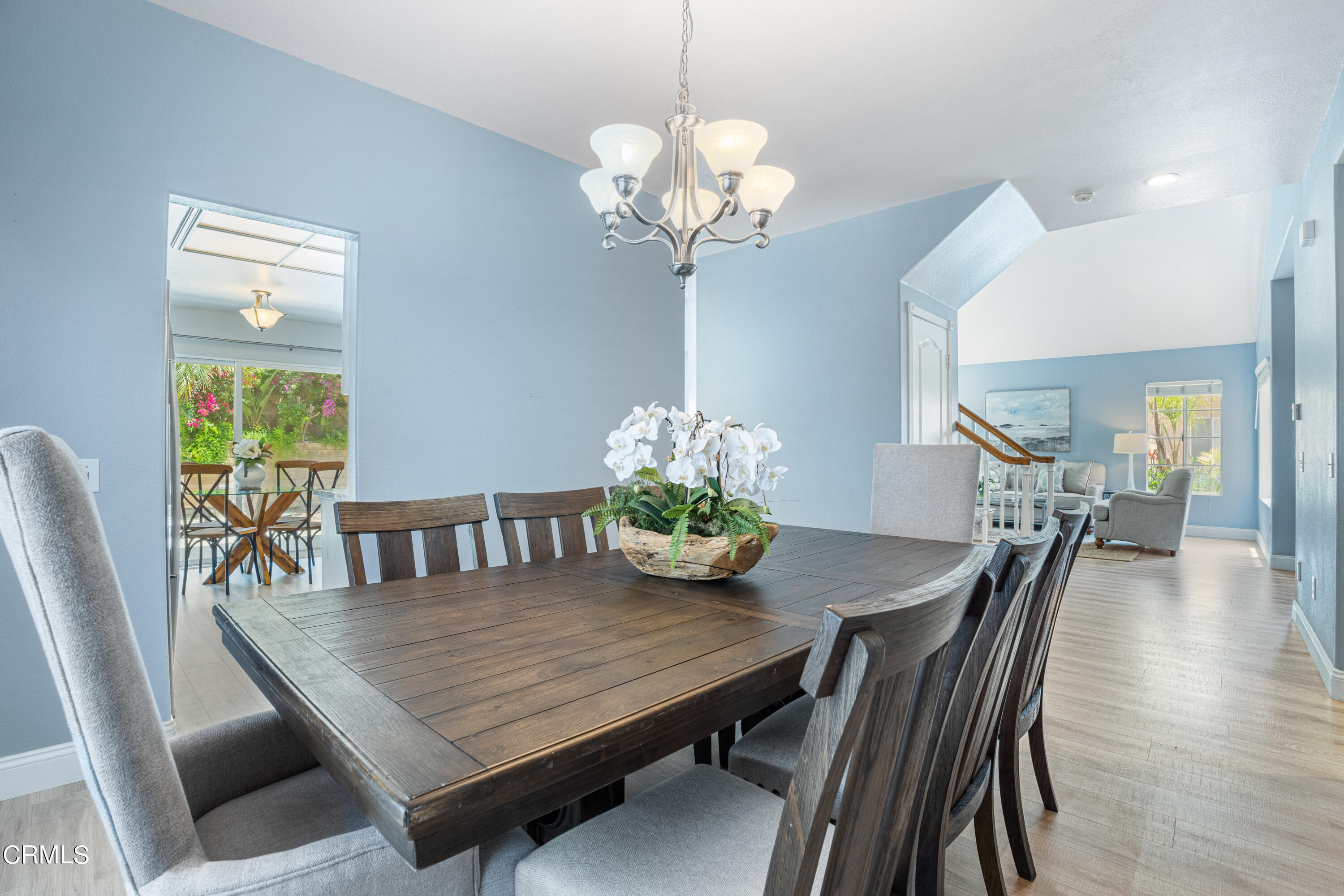 15737 Milne Circle Moorpark, CA 93021 - Photo 14 of 38 a dining room with furniture potted plants and wooden floor