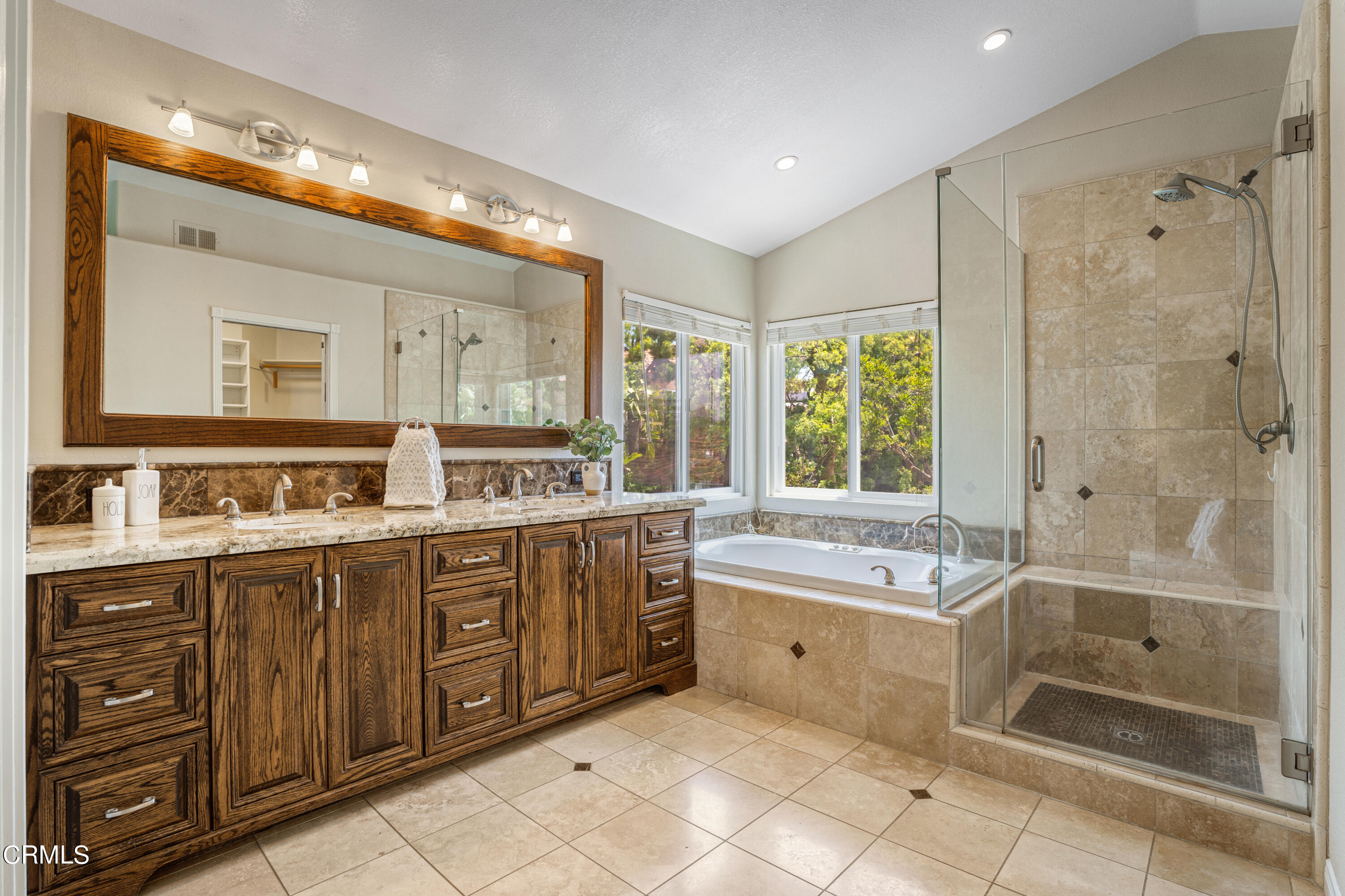 15737 Milne Circle Moorpark, CA 93021 - Photo 18 of 38 a spacious bathroom with a tub sink shower and mirror