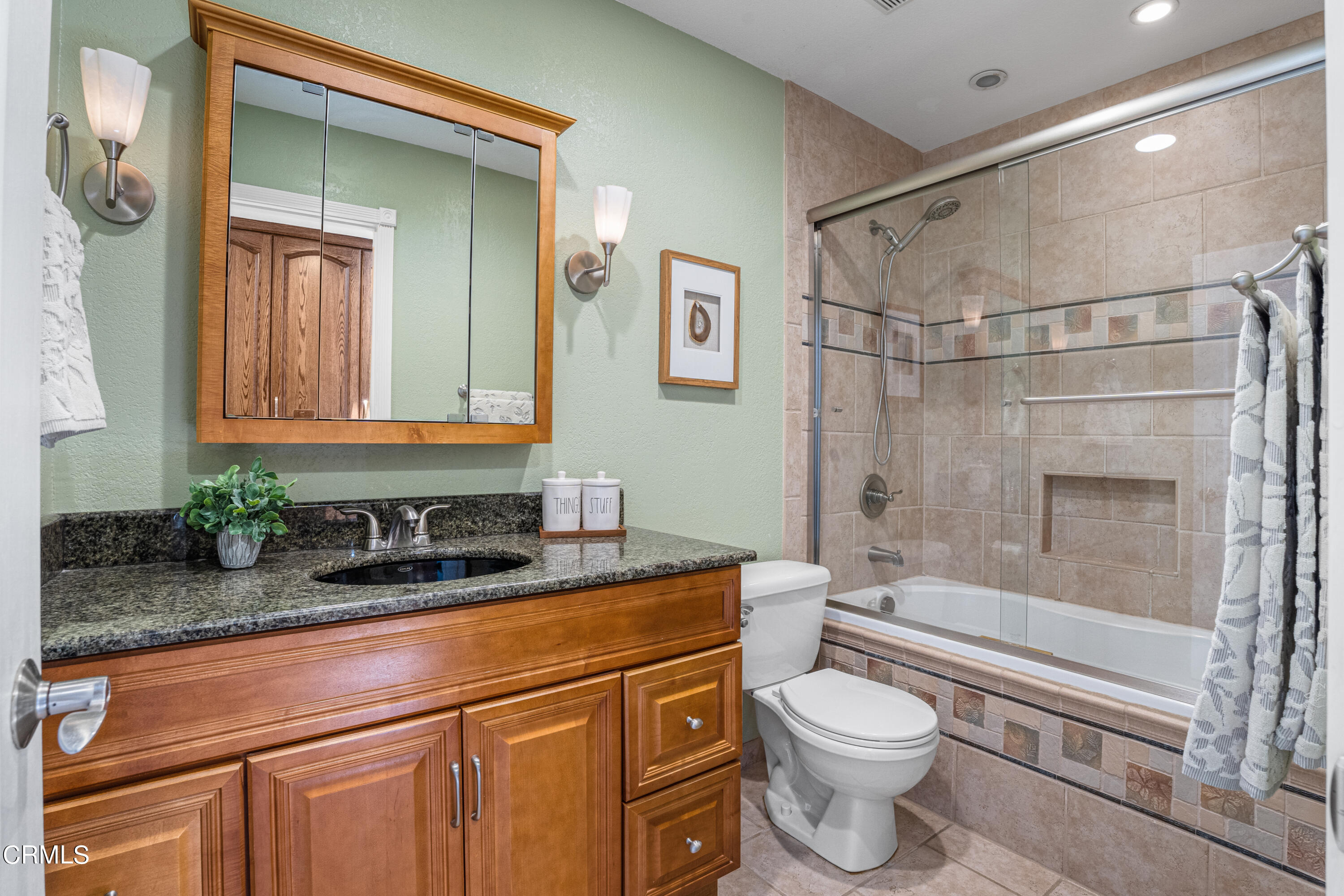 15737 Milne Circle Moorpark, CA 93021 - Photo 25 of 38 a bathroom with a granite countertop sink toilet and shower