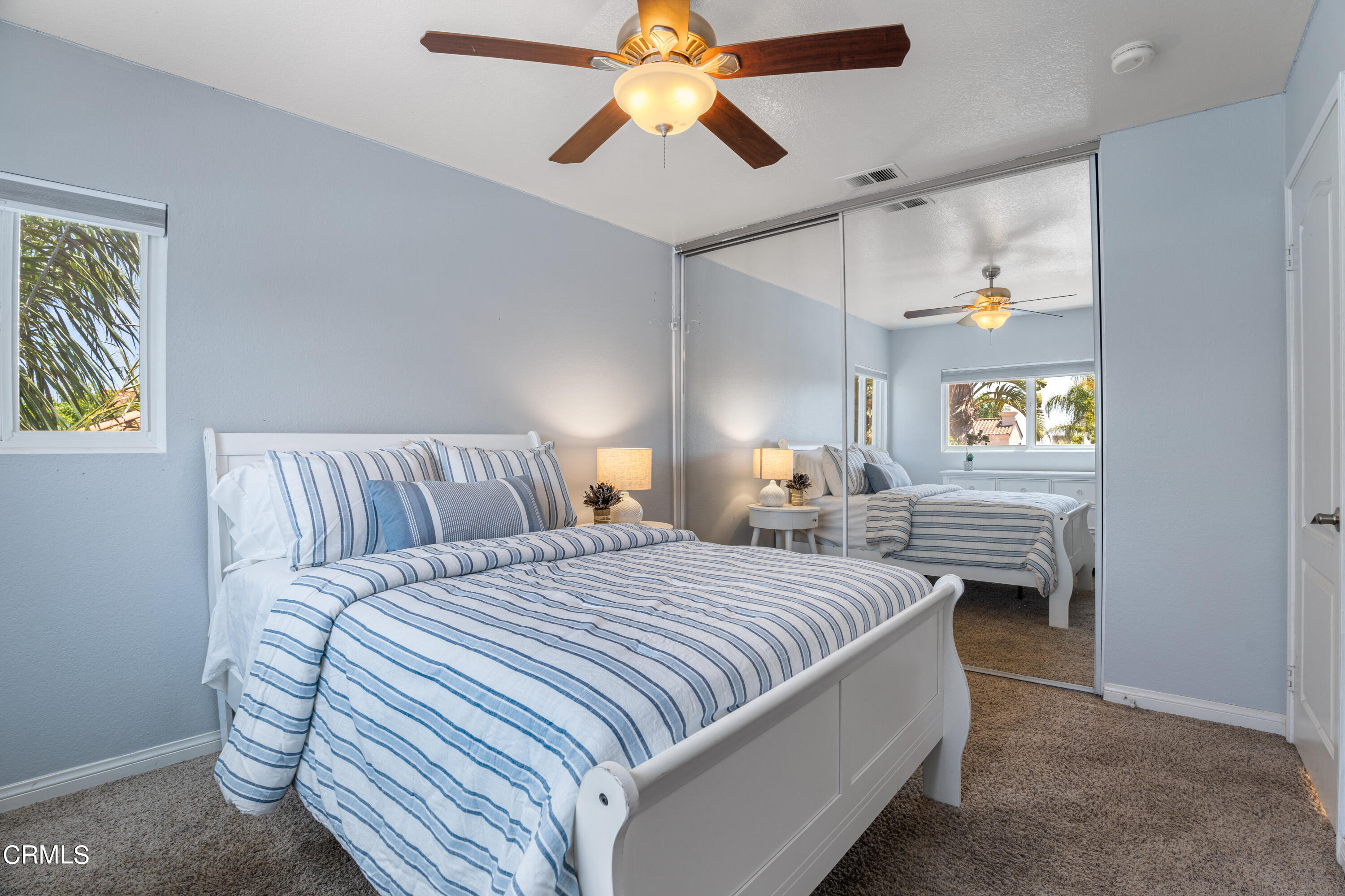 15737 Milne Circle Moorpark, CA 93021 - Photo 27 of 38 a bedroom with a bed and a chandelier