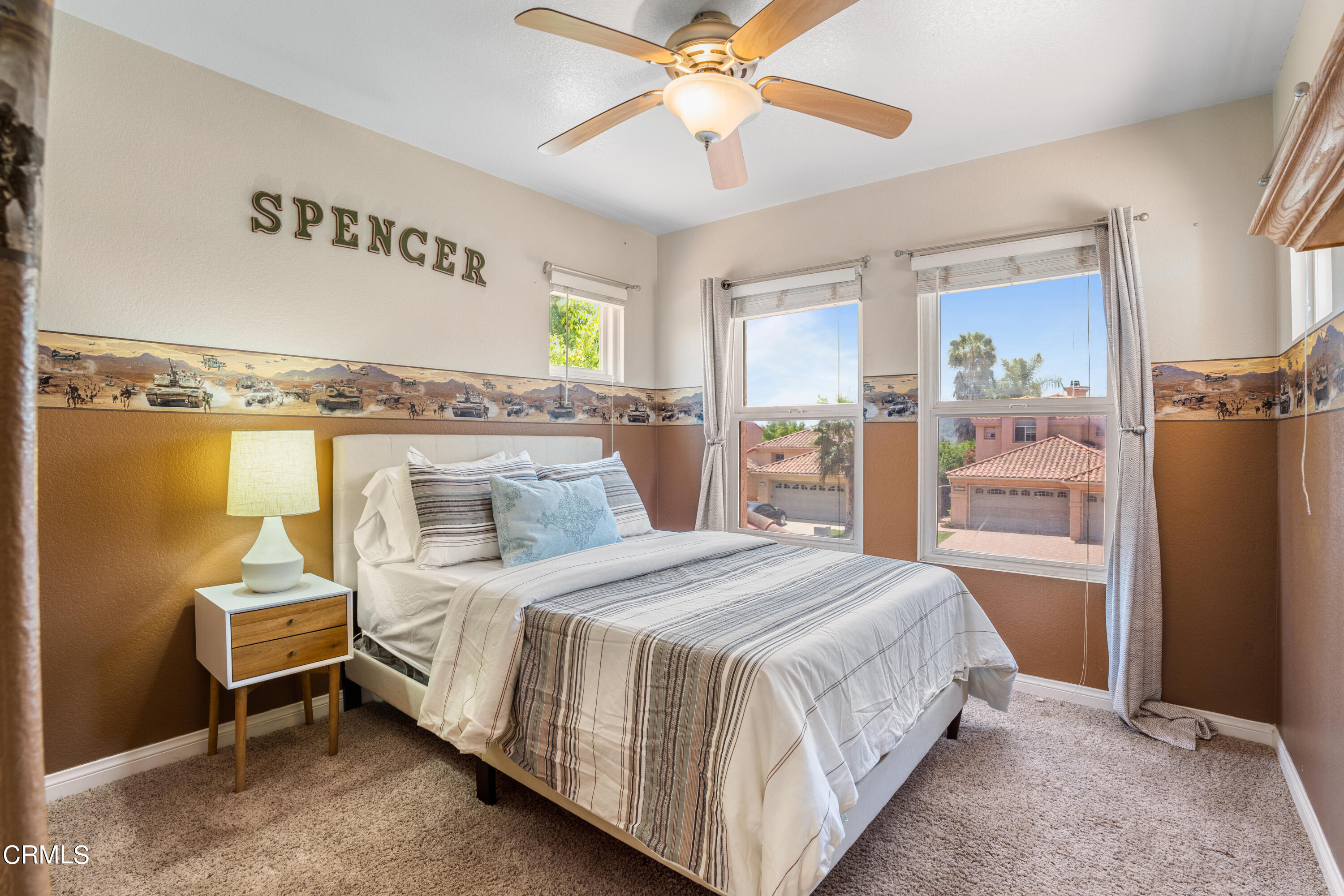 15737 Milne Circle Moorpark, CA 93021 - Photo 28 of 38 a bedroom with a bed and a chandelier