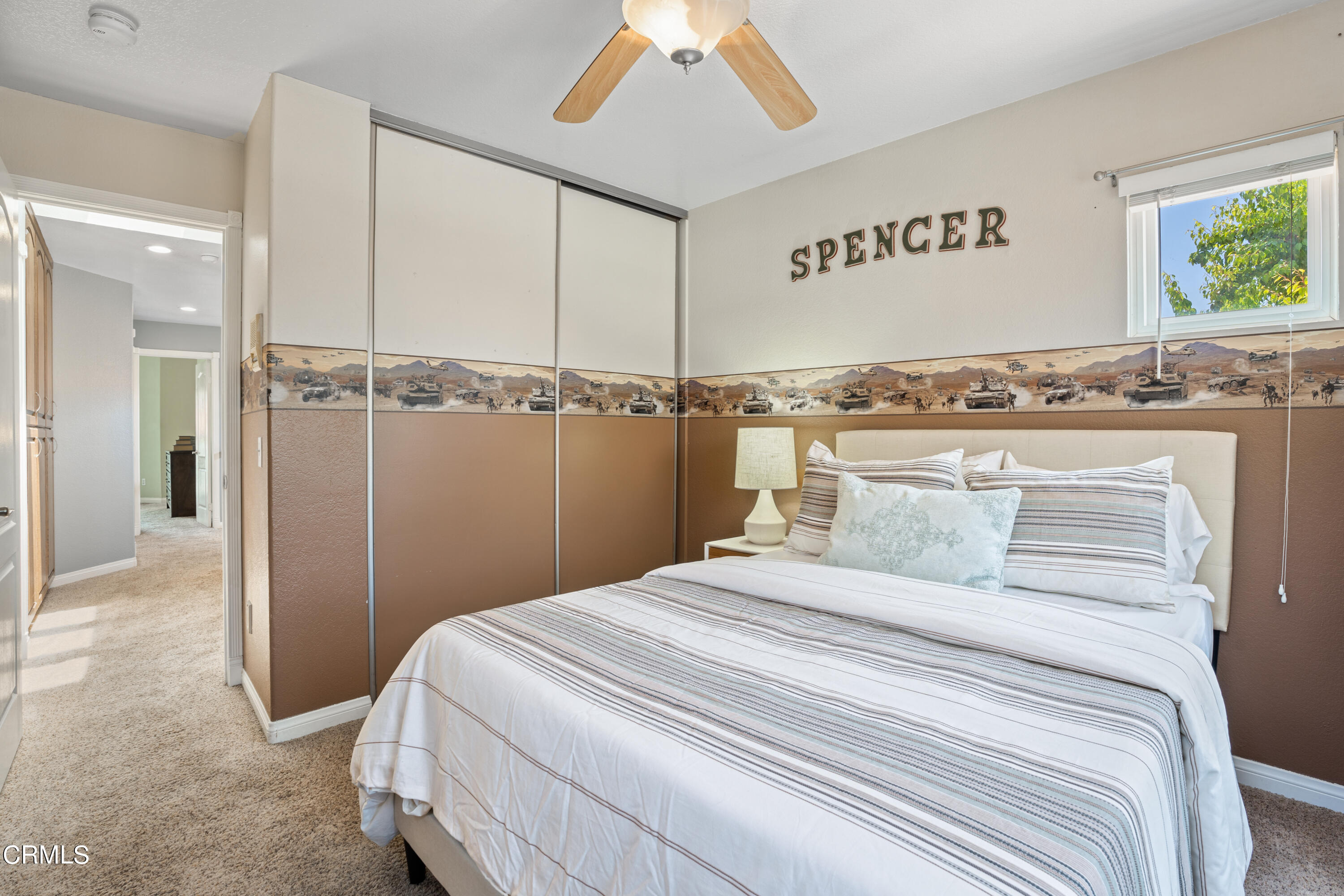 15737 Milne Circle Moorpark, CA 93021 - Photo 29 of 38 a bedroom with a large bed and a chandelier
