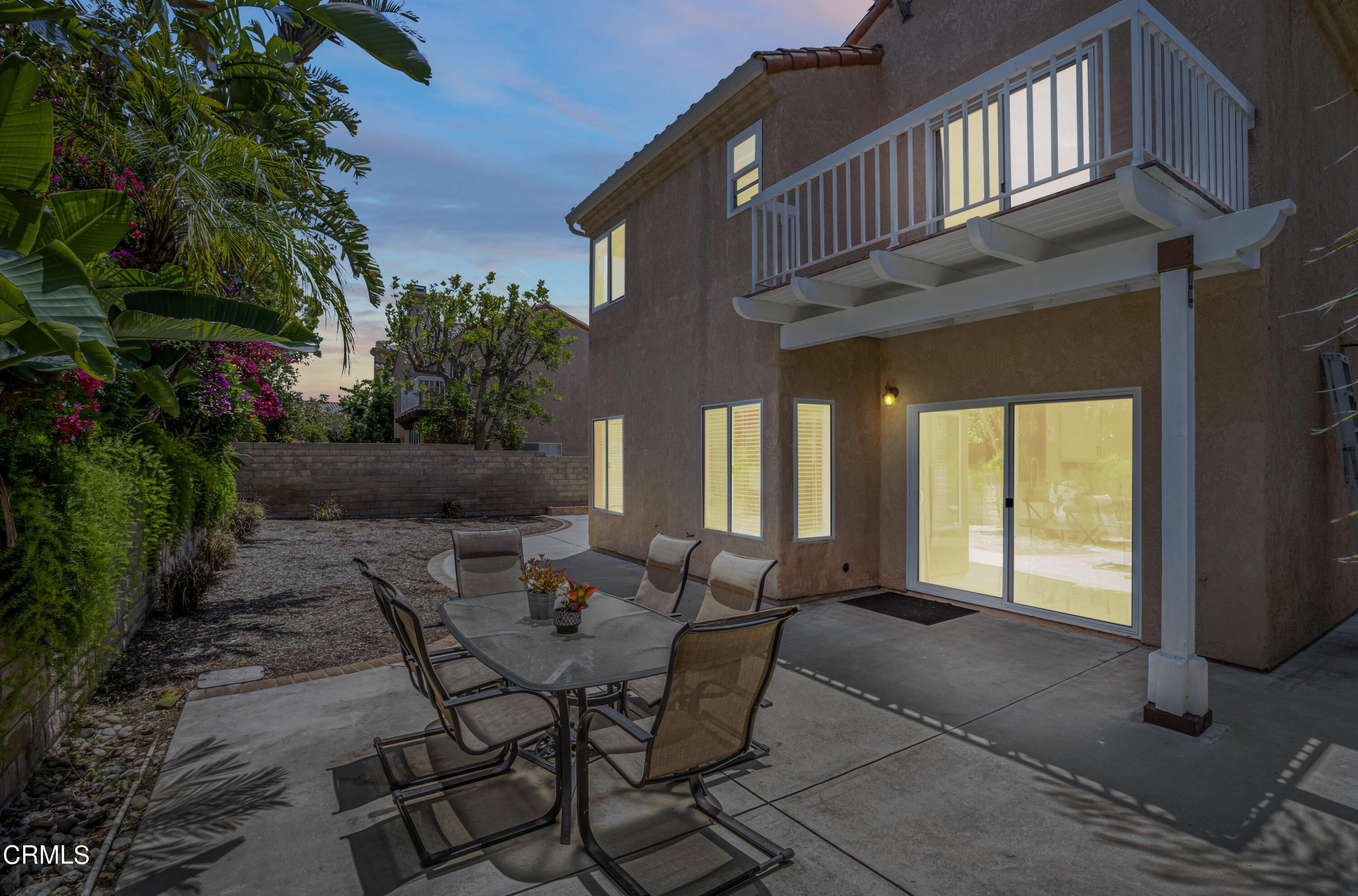 15737 Milne Circle Moorpark, CA 93021 - Photo 32 of 38 a view of a patio with table and chairs and potted plants
