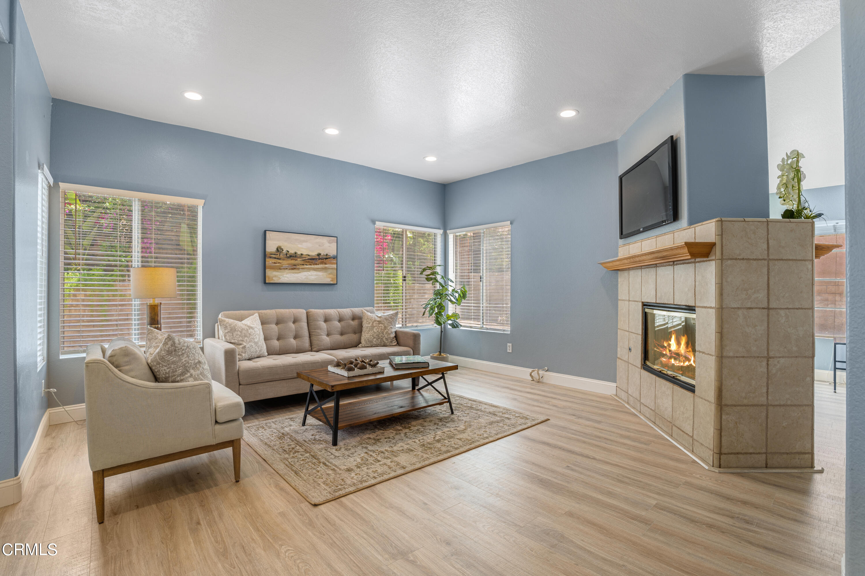 15737 Milne Circle Moorpark, CA 93021 - Photo 7 of 38 a living room with furniture and a fireplace