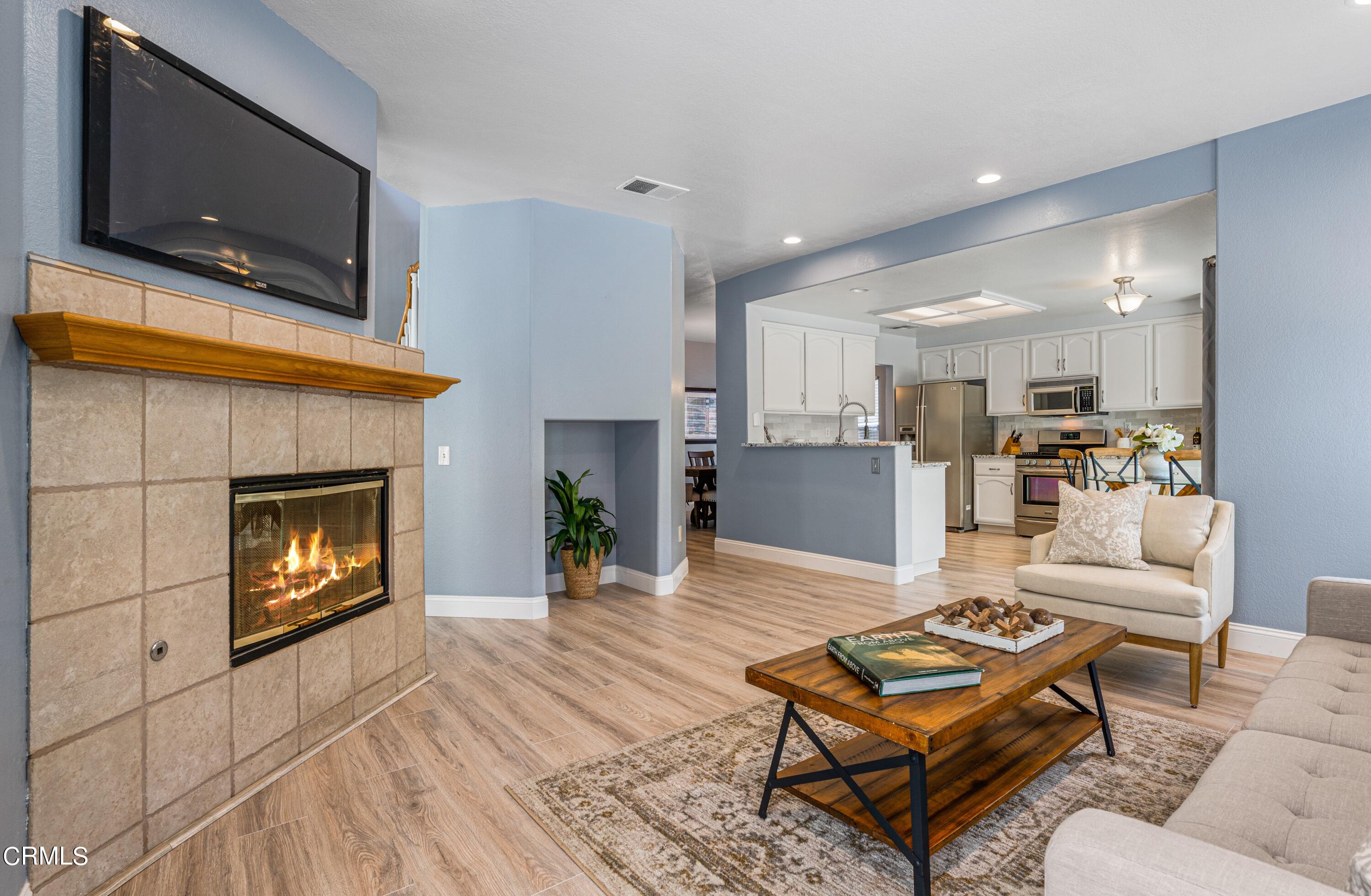 15737 Milne Circle Moorpark, CA 93021 - Photo 8 of 38 a living room with furniture and a fireplace