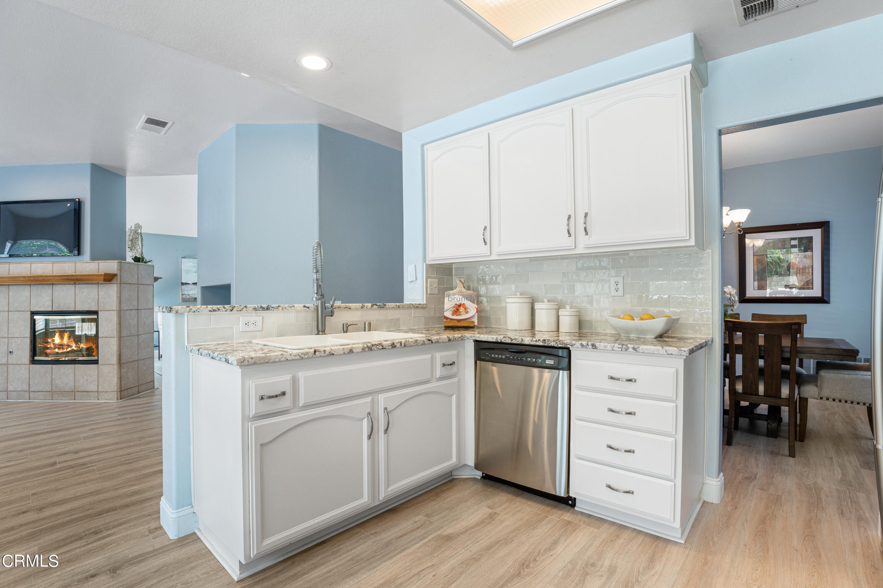 15737 Milne Circle Moorpark, CA 93021 - Photo 9 of 38 a kitchen with cabinets appliances and wooden floor