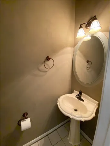 a bathroom with a sink and mirror