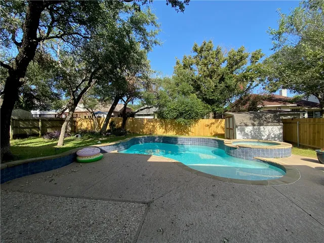 a view of a park with large trees