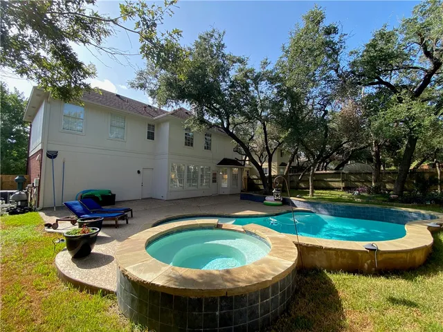 a view of swimming pool with seating space