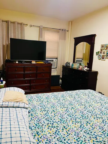 a living room with a couch and a flat screen tv