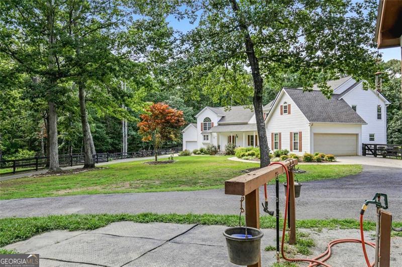 2203 Arbor Hill Road Canton, GA 30115 - Photo 21 of 64 a front view of a house with garden