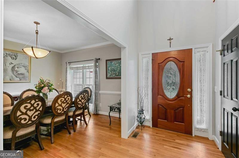2203 Arbor Hill Road Canton, GA 30115 - Photo 30 of 64 a view of a dining room with furniture window and wooden floor