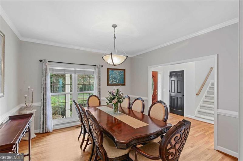 2203 Arbor Hill Road Canton, GA 30115 - Photo 32 of 64 a view of a dining room with furniture window and wooden floor