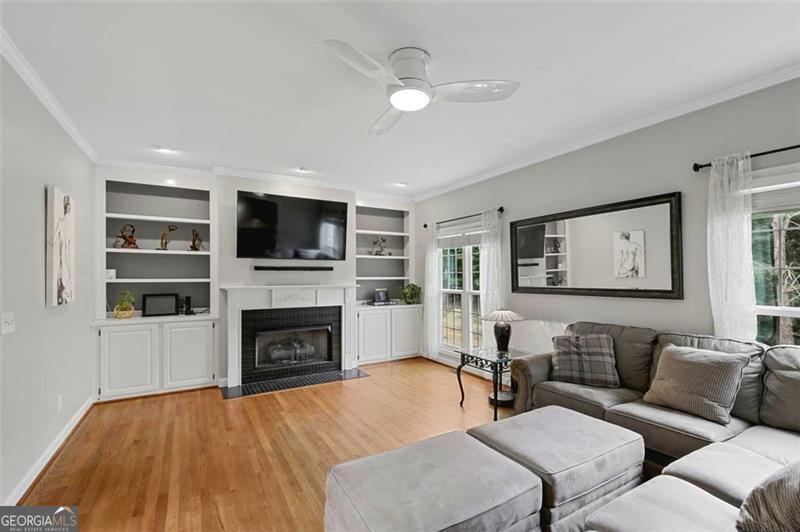 2203 Arbor Hill Road Canton, GA 30115 - Photo 34 of 64 a living room with furniture and a fireplace