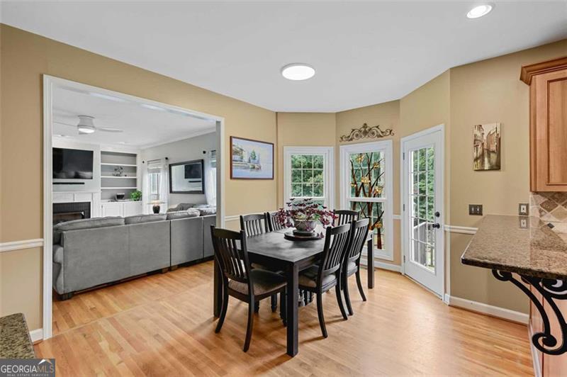 2203 Arbor Hill Road Canton, GA 30115 - Photo 36 of 64 a view of a dining room with furniture and wooden floor