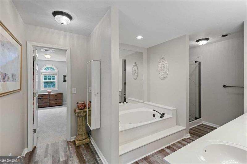 2203 Arbor Hill Road Canton, GA 30115 - Photo 43 of 64 a bathroom with a bathtub and a shower