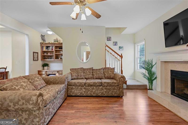2203 Arbor Hill Road Canton, GA 30115 - Photo 55 of 64 a living room with furniture and a fireplace