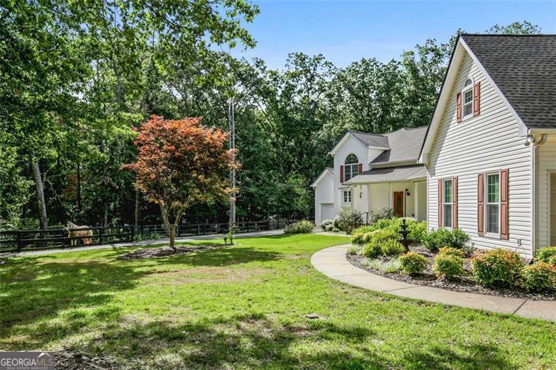 2203 Arbor Hill Road Canton, GA 30115 - Photo 10 of 64 a front view of a house with a yard