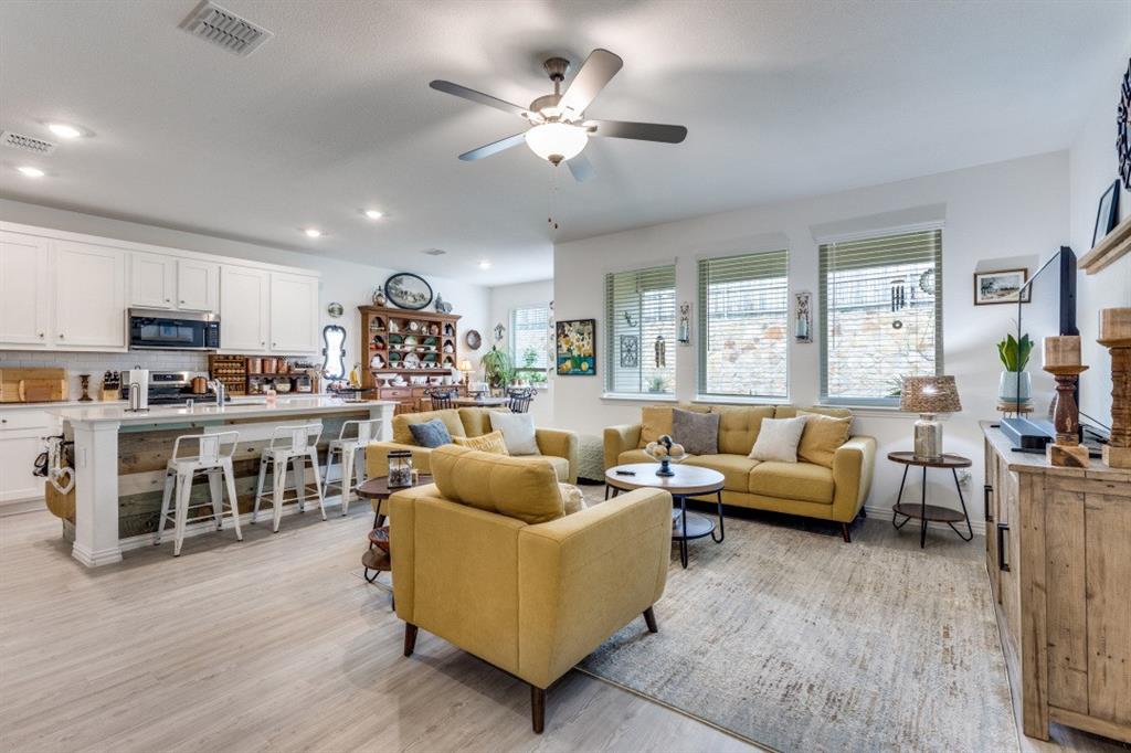 1213 Dragon Street Azle, TX 76020 - Photo 15 of 27 a living room with furniture kitchen view and a large window