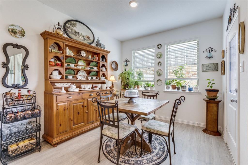 1213 Dragon Street Azle, TX 76020 - Photo 20 of 27 a view of a dining room with furniture window and wooden floor
