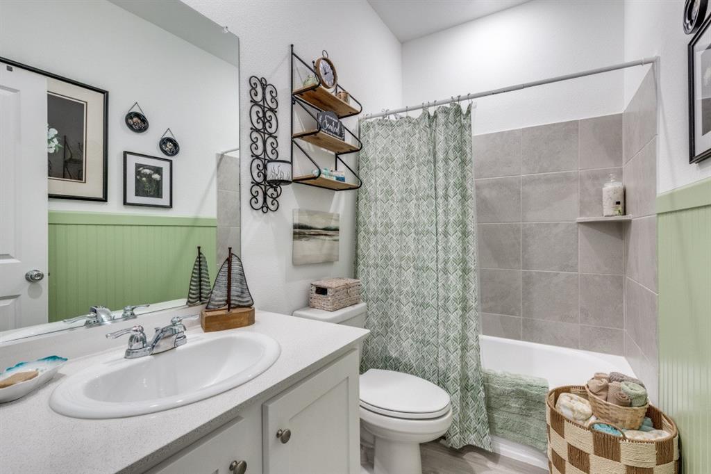1213 Dragon Street Azle, TX 76020 - Photo 26 of 27 a bathroom with a sink toilet and shower