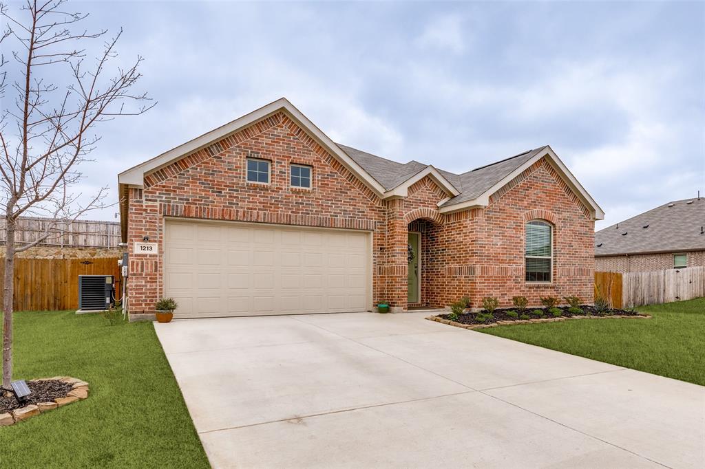 1213 Dragon Street Azle, TX 76020 - Photo 3 of 27 a front view of a house with a yard and garage