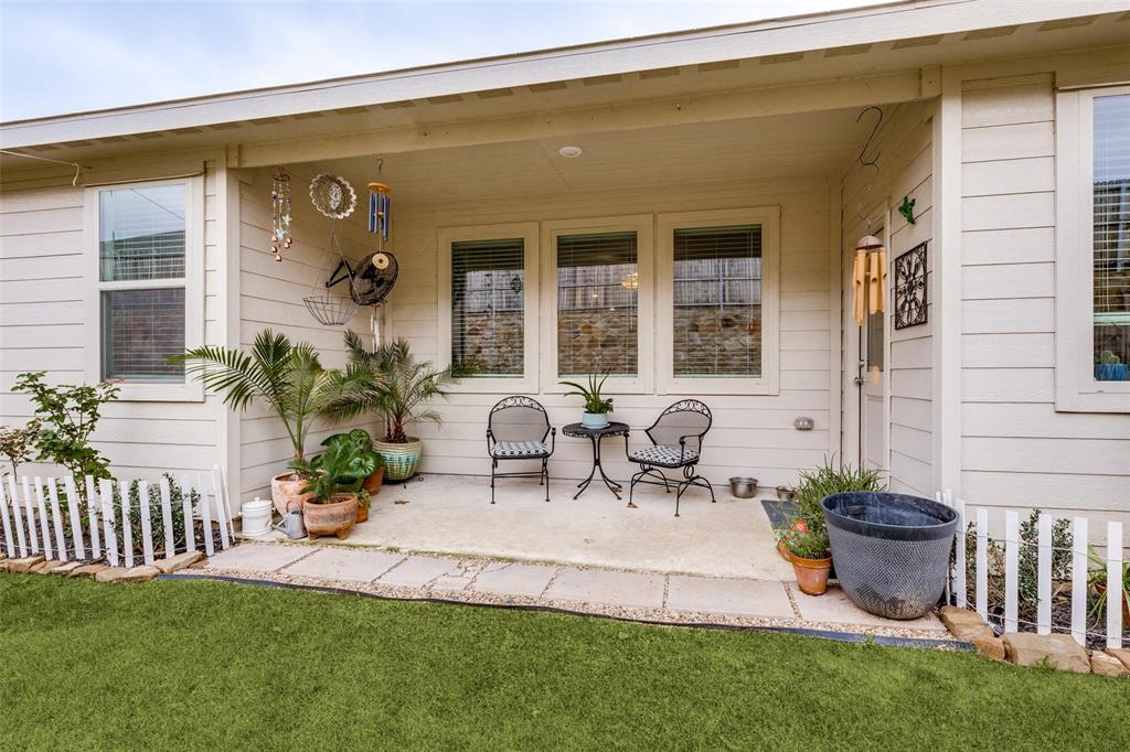1213 Dragon Street Azle, TX 76020 - Photo 8 of 27 a view of a house with patio and a garden