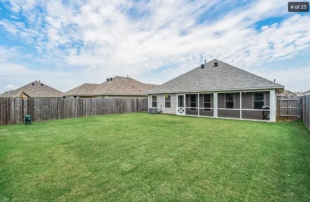 a view of a house with a backyard