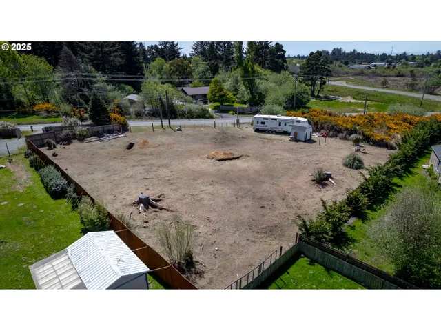 a backyard of a house with a yard and outdoor seating