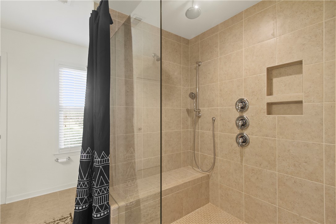 2900 Highway 187 Anderson, SC 29626 - Photo 23 of 41 Relax in the spacious, fully tiled shower with convenient built-in shelving.