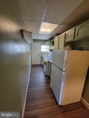 a view of a storage & utility room with wooden floor