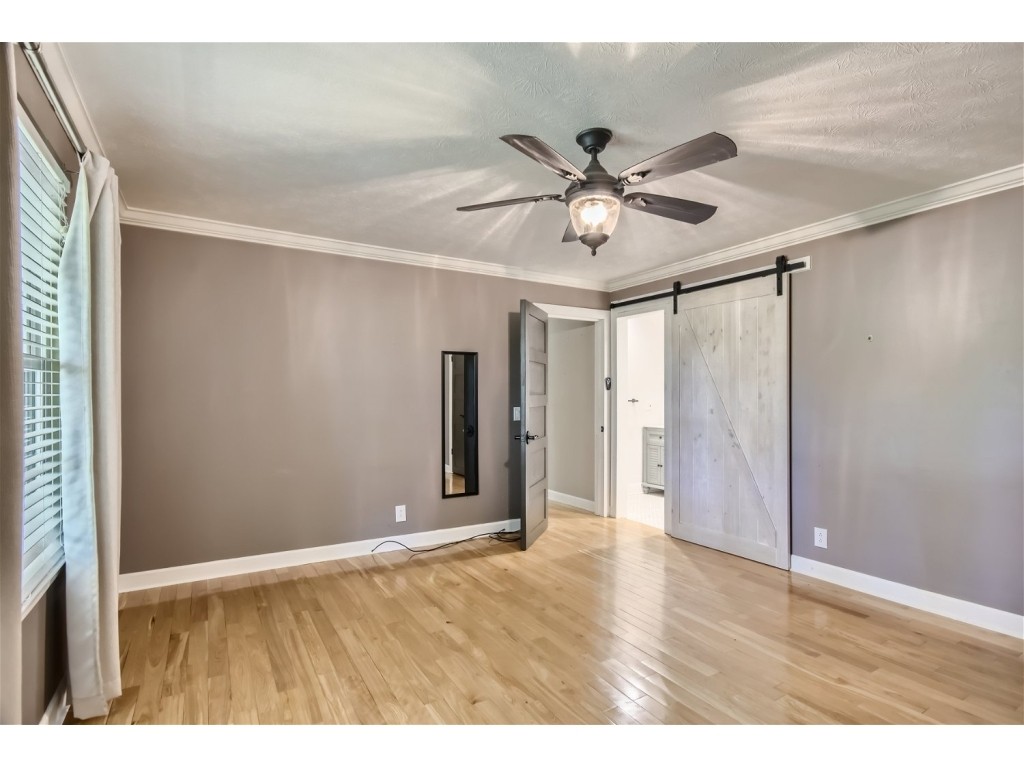 6824 Beckwith Road Mount Juliet, TN 37122 - Photo 12 of 36 a view of an empty room with wooden floor