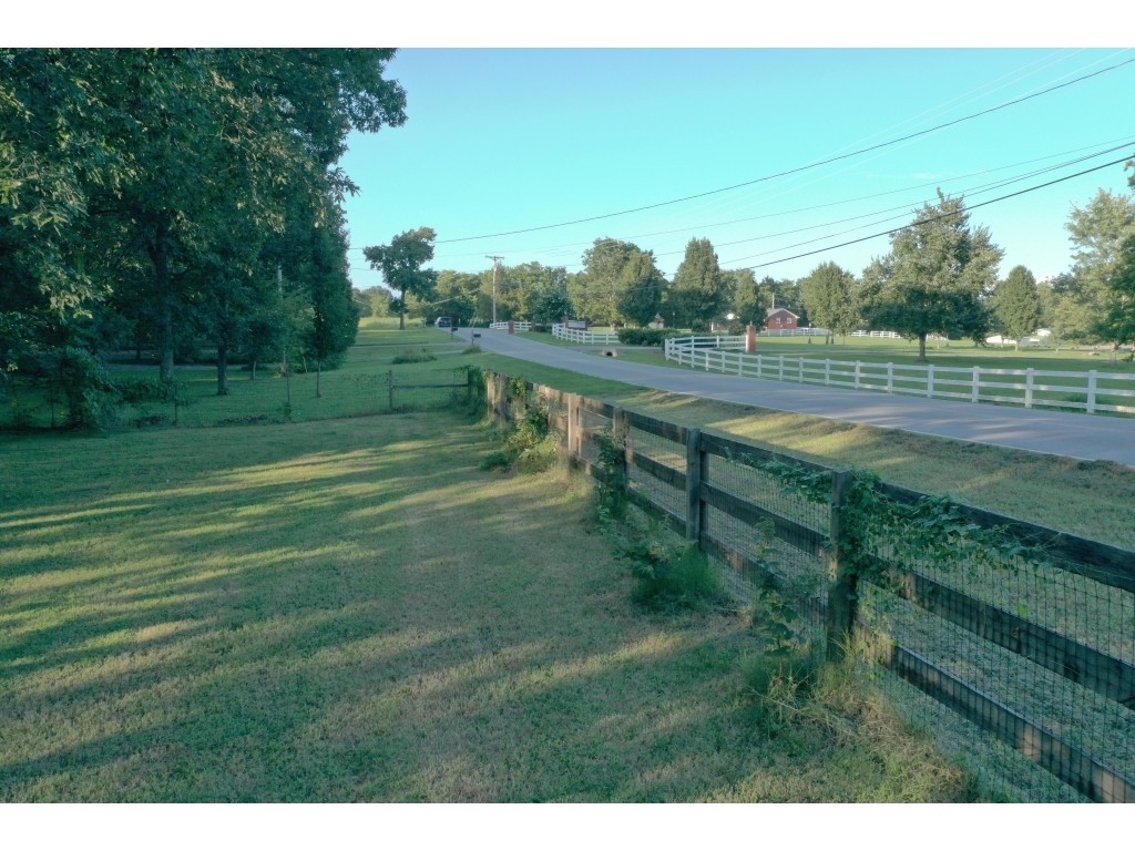 6824 Beckwith Road Mount Juliet, TN 37122 - Photo 34 of 36 a view of a green field with wooden fence