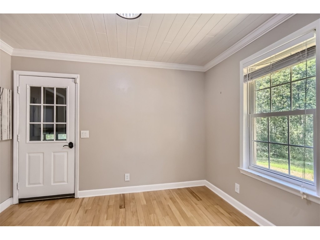 6824 Beckwith Road Mount Juliet, TN 37122 - Photo 8 of 36 an empty room with wooden floor and windows