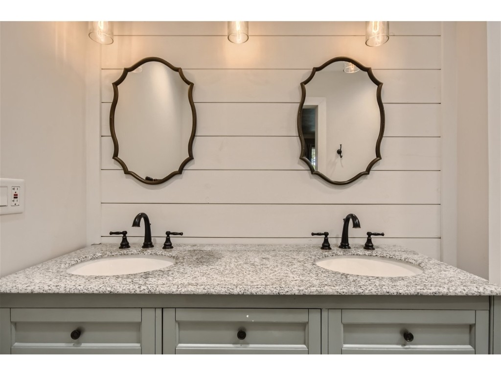 6824 Beckwith Road Mount Juliet, TN 37122 - Photo 9 of 36 a bathroom with a granite countertop sink and a mirror
