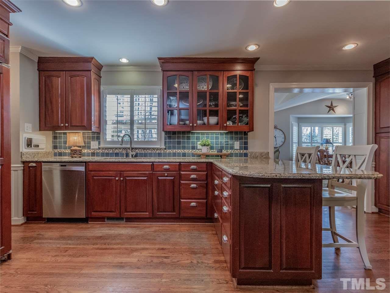 1003 Queensferry Road Cary, NC 27511 - Photo 11 of 30 Kitchen opens to the sunroom and den