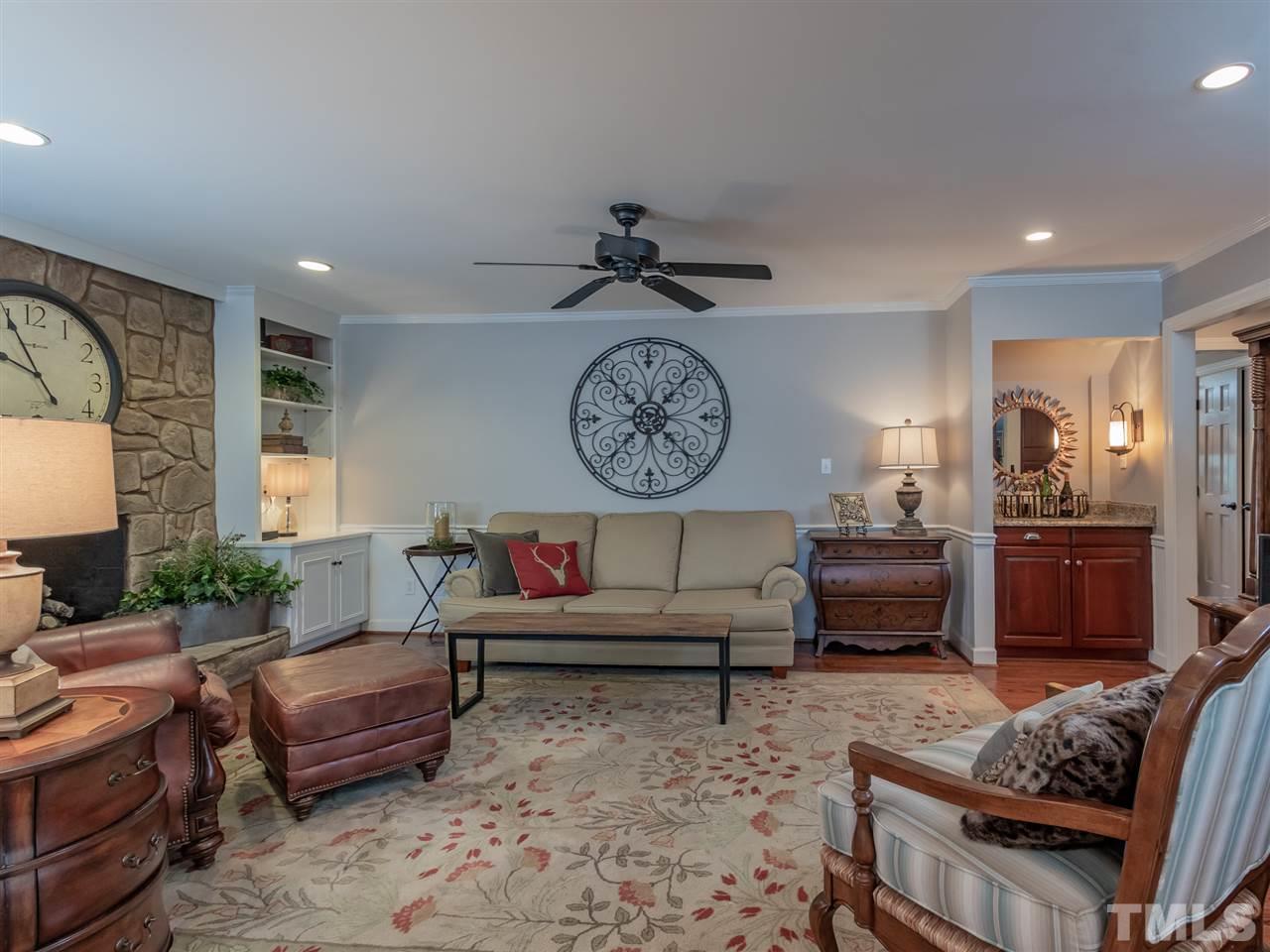 1003 Queensferry Road Cary, NC 27511 - Photo 14 of 30 Family room with stone fireplace and wet bar