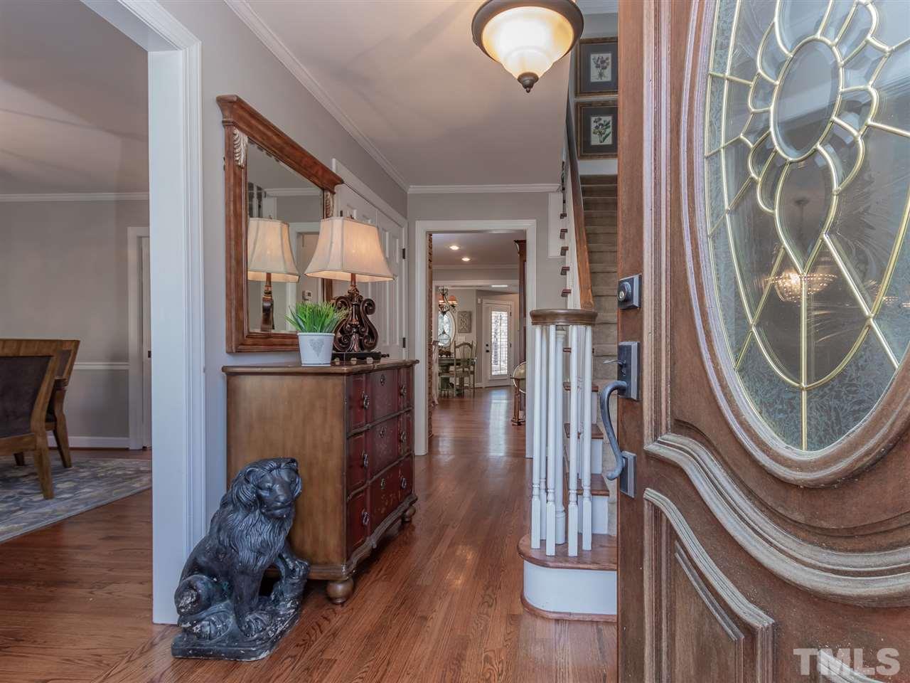 1003 Queensferry Road Cary, NC 27511 - Photo 4 of 30 Welcoming entry way - light and bright interior! First floor hardwoods.
