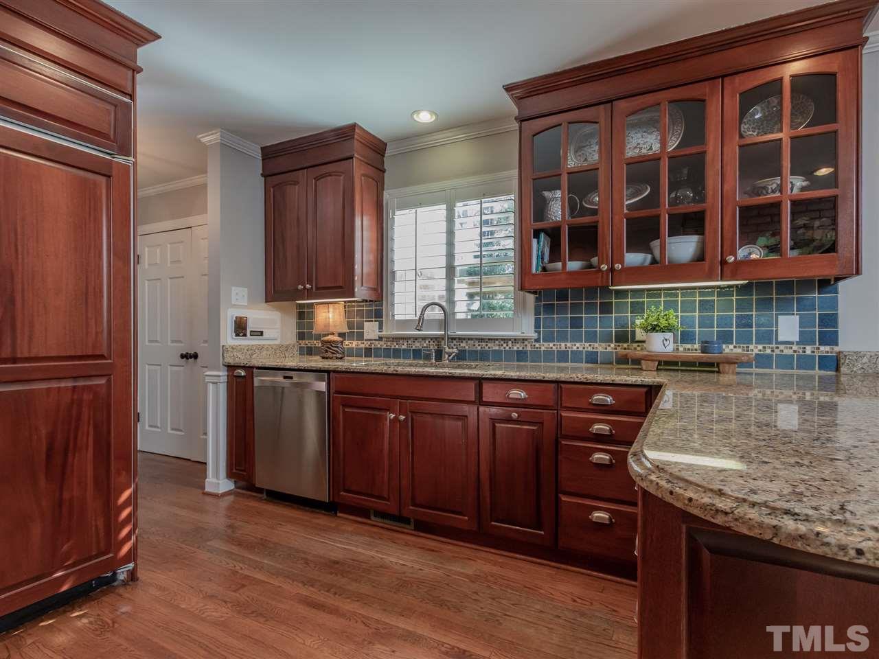1003 Queensferry Road Cary, NC 27511 - Photo 10 of 30 Abundant cabinets and extensive granite counter tops!