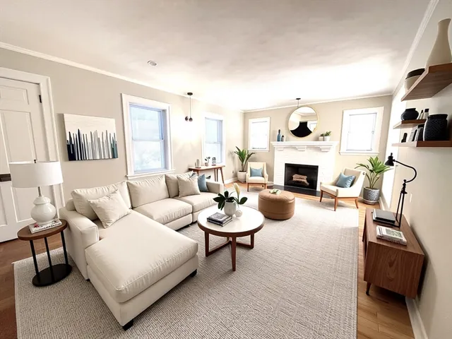 a living room with furniture a fireplace and a flat screen tv