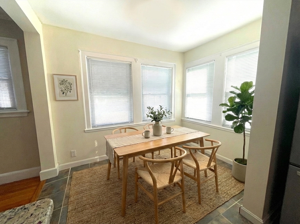 76 Cloverdale Road, Unit 76 Newton, MA 02461 - Photo 3 of 9 a dining room with furniture and window