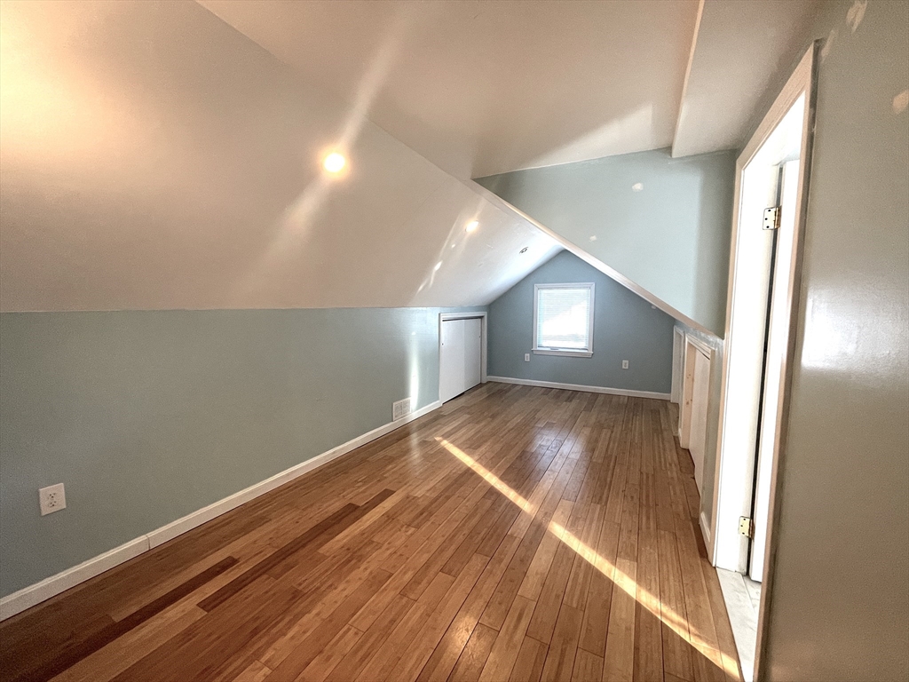 76 Cloverdale Road, Unit 76 Newton, MA 02461 - Photo 8 of 10 a view of empty room with wooden floor