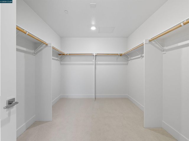 a view of a room with shelf on the wall